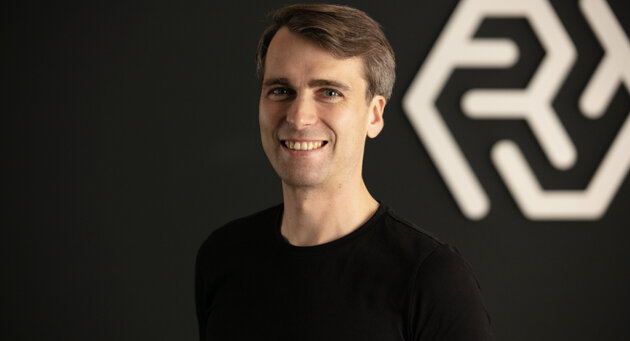 Alexander Müller smiles into the camera