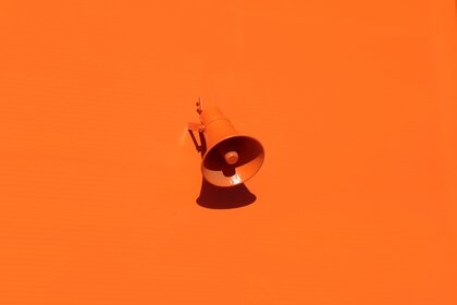 Orange speaker on orange background