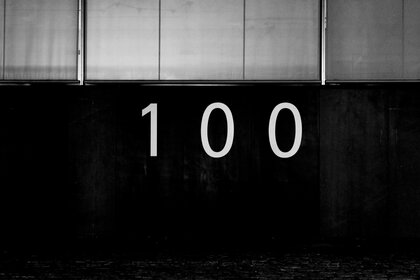 The number 100 on a black background